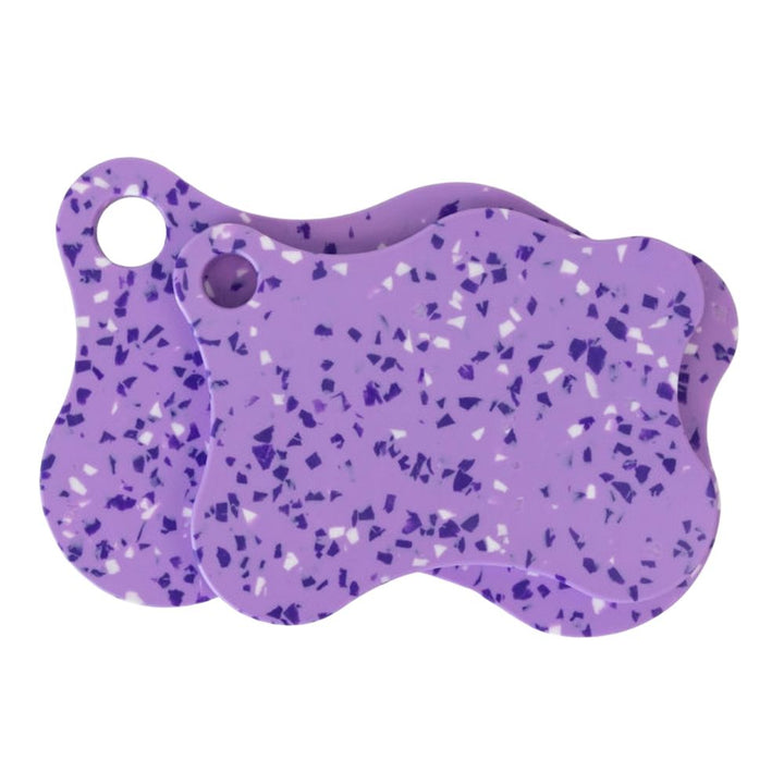 Nibble & Rest Plum Mama and Mini chopping board set stacked together, featuring a violet and blue speckled design with hanging holes.